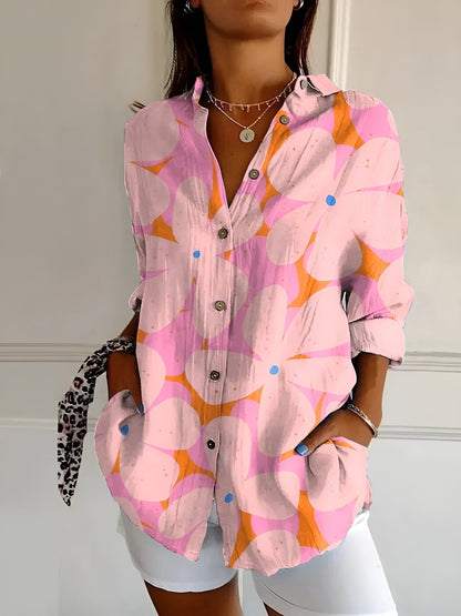 Elegant dames button-up hemd in ademend katoen, lichtblauw met bloemmotief. Geschikt voor zakelijke en casual gelegenheden.