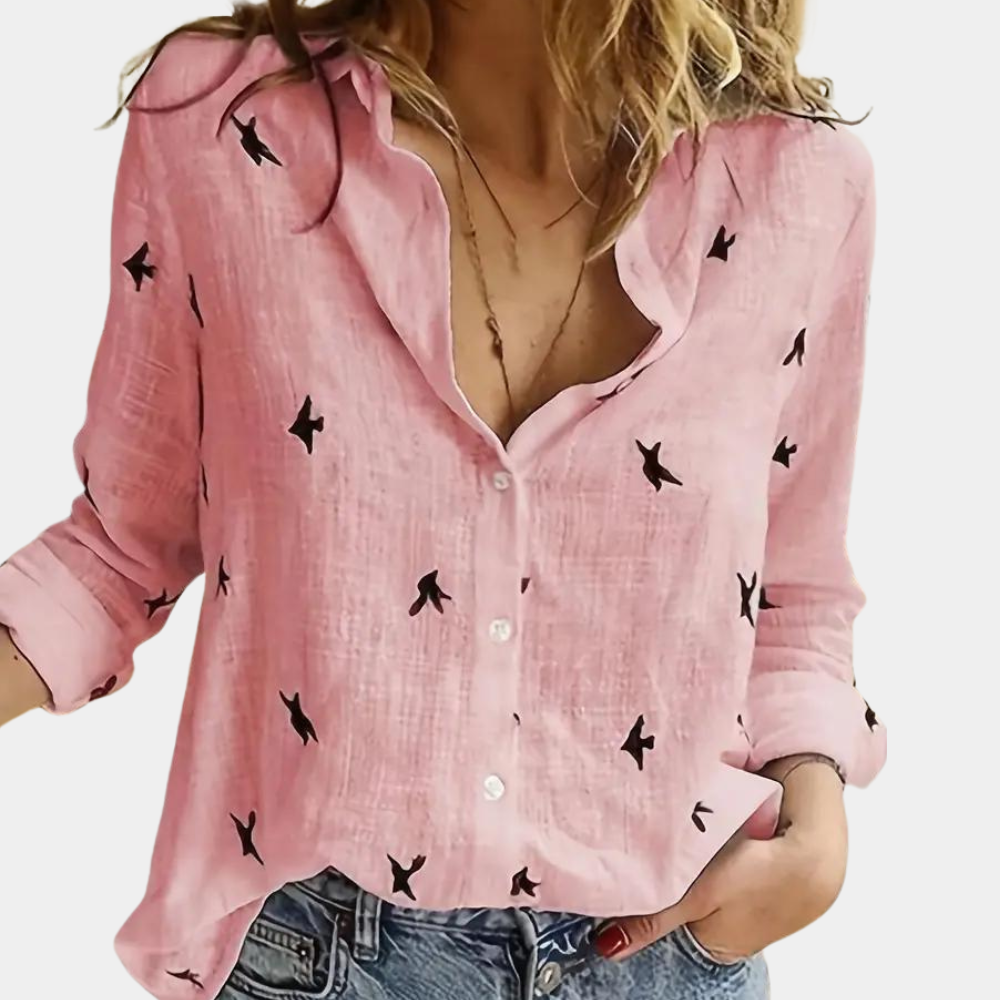 "Elegant dameshemd met lange mouwen, zwaluwprint en knoopsluiting. Perfect voor casual en zakelijke outfits."