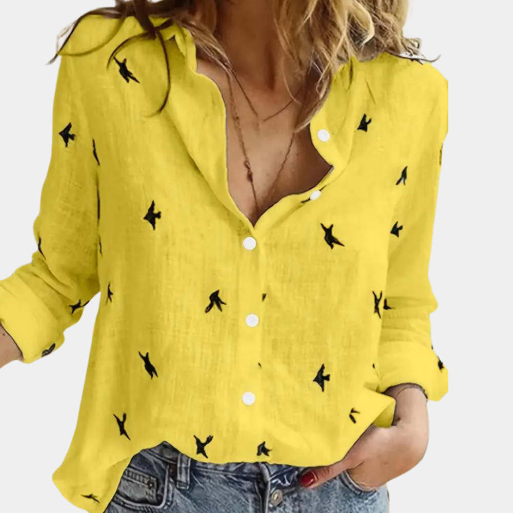 "Elegant dameshemd met lange mouwen, zwaluwprint en knoopsluiting. Perfect voor casual en zakelijke outfits."