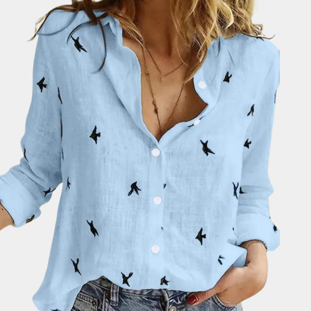 "Elegant dameshemd met lange mouwen, zwaluwprint en knoopsluiting. Perfect voor casual en zakelijke outfits."