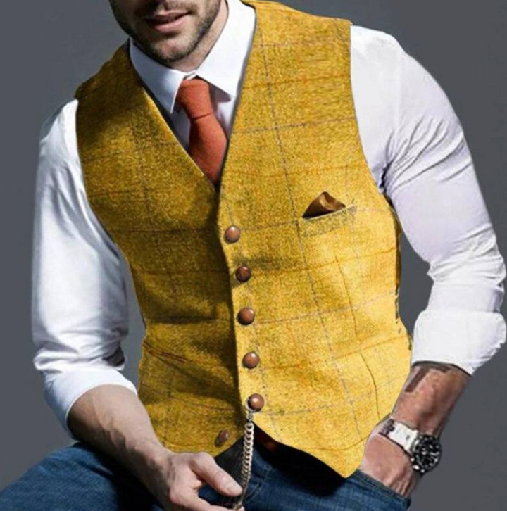 "Elegant donkergrijs herengilet van tweedstof, klassiek en veelzijdig, ideaal voor zowel formele als casual gelegenheden."