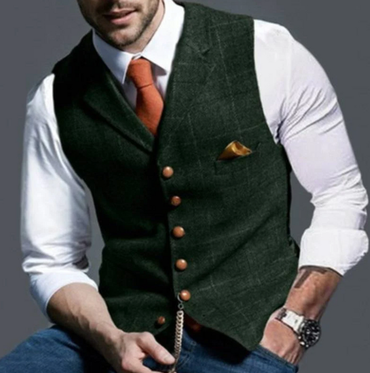"Elegant donkergrijs herengilet van tweedstof, klassiek en veelzijdig, ideaal voor zowel formele als casual gelegenheden."