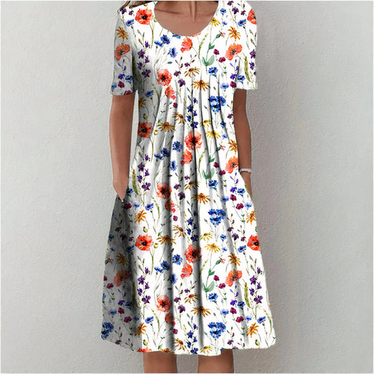 "Elegante blauwe katoenen jurk met bloemmotief, vloeiend silhouet, veelzijdig voor casual en formele gelegenheden."