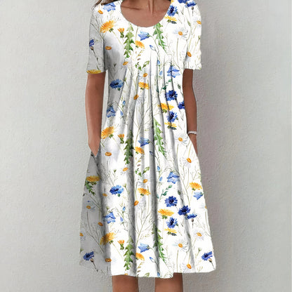 "Elegante blauwe katoenen jurk met bloemmotief, vloeiend silhouet, veelzijdig voor casual en formele gelegenheden."