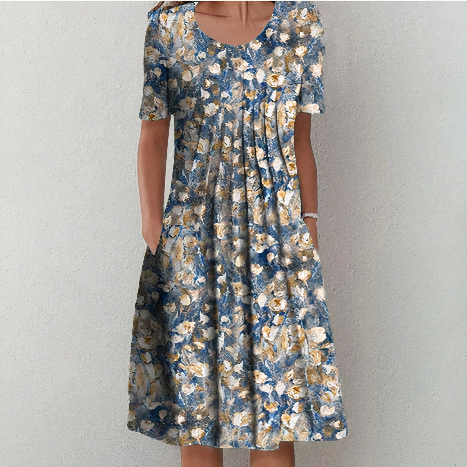 "Elegante blauwe katoenen jurk met bloemmotief, vloeiend silhouet, veelzijdig voor casual en formele gelegenheden."