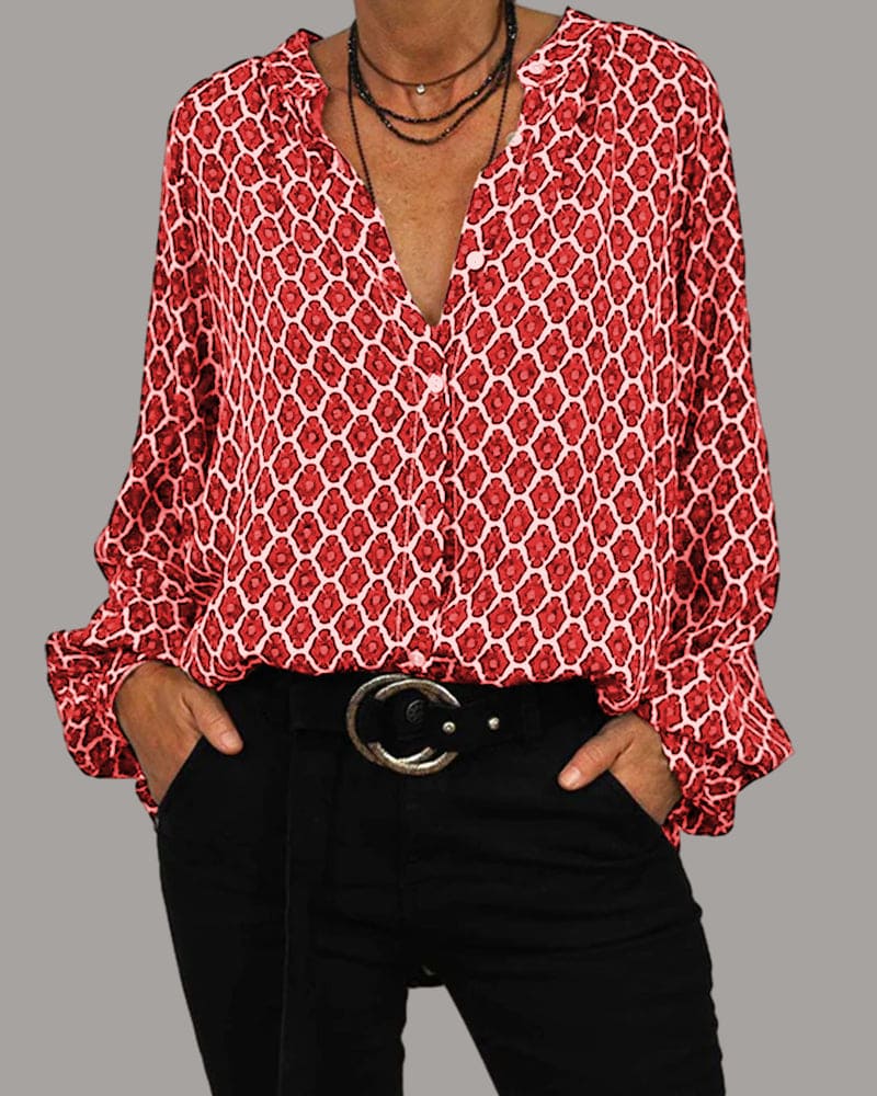 Elegante blouse met V-hals en geometrisch design, subtiele knoopdetails, ideaal voor zowel zakelijke als casual gelegenheden.