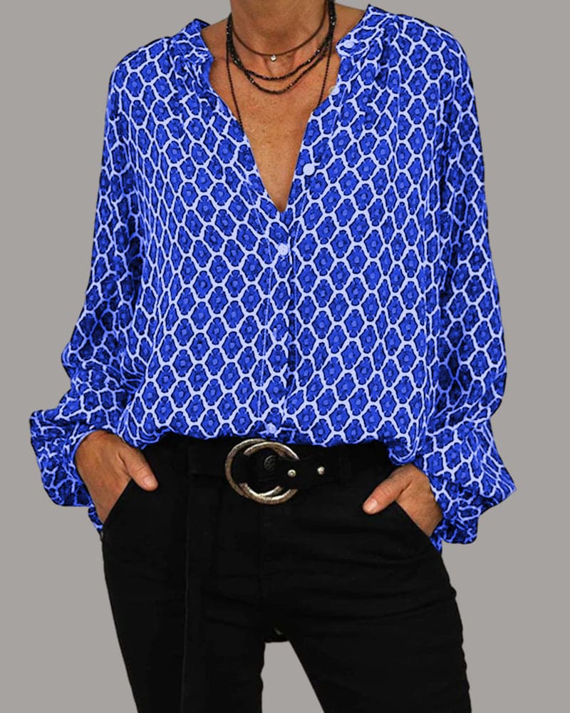 Elegante blouse met V-hals en geometrisch design, subtiele knoopdetails, ideaal voor zowel zakelijke als casual gelegenheden.