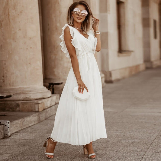 Elegante bohemian Fleurine jurk met V-hals in luchtige chiffon stof, ideaal voor zomerfeesten en bruiloften.