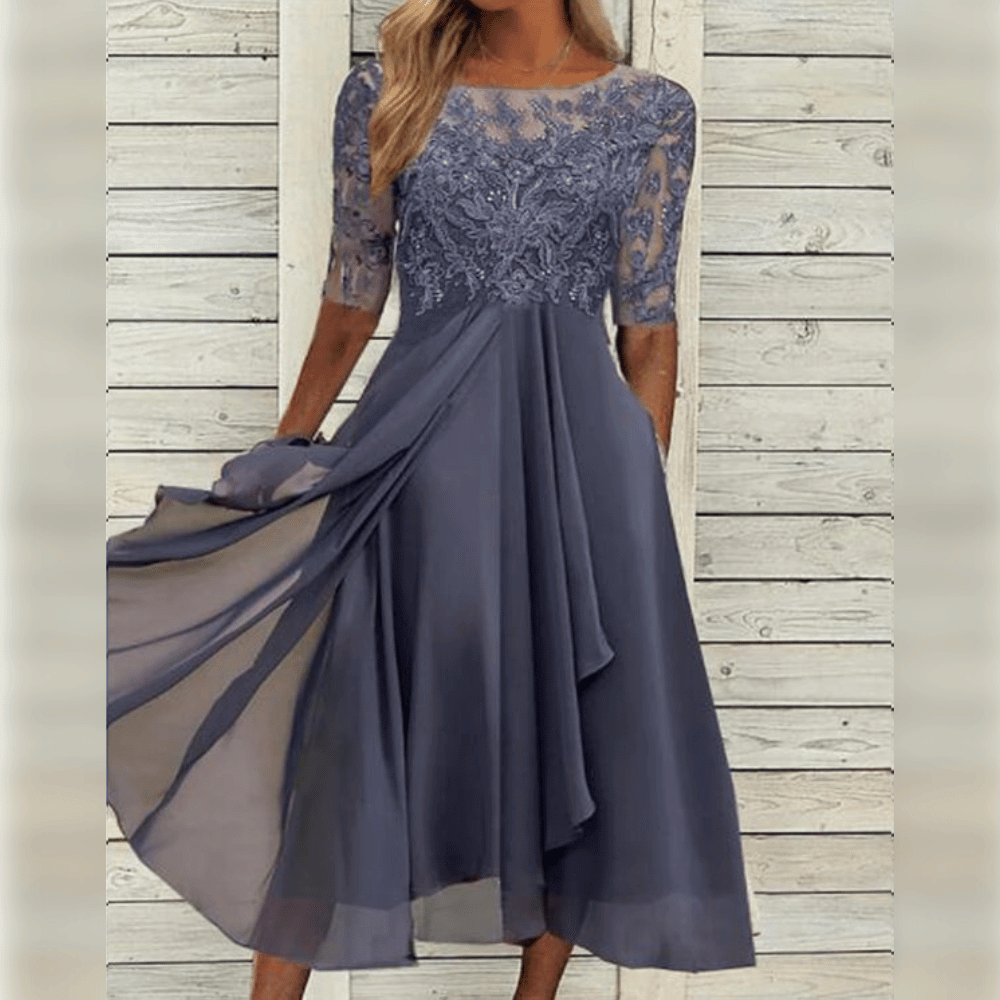 Elegante chiffon jurk met kant, halflange mouwen en flatterende pasvorm, perfect voor feestelijke gelegenheden.