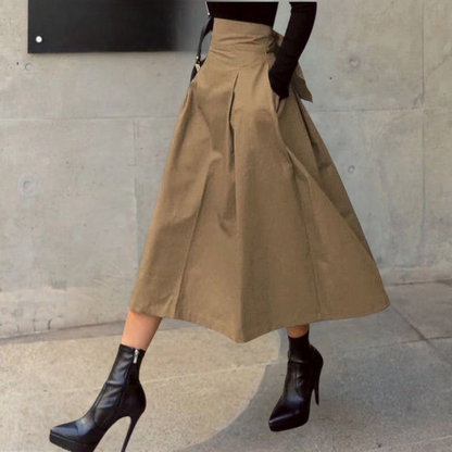 "Elegante damesrok met hoge taille in groen, licht uitlopend, van zacht katoen voor een modieuze en comfortabele look."