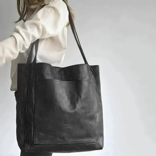 "Elegante leren damestas met ruime opbergruimte en veilige sluiting, ideaal voor moderne vrouwen, verkrijgbaar in diverse kle