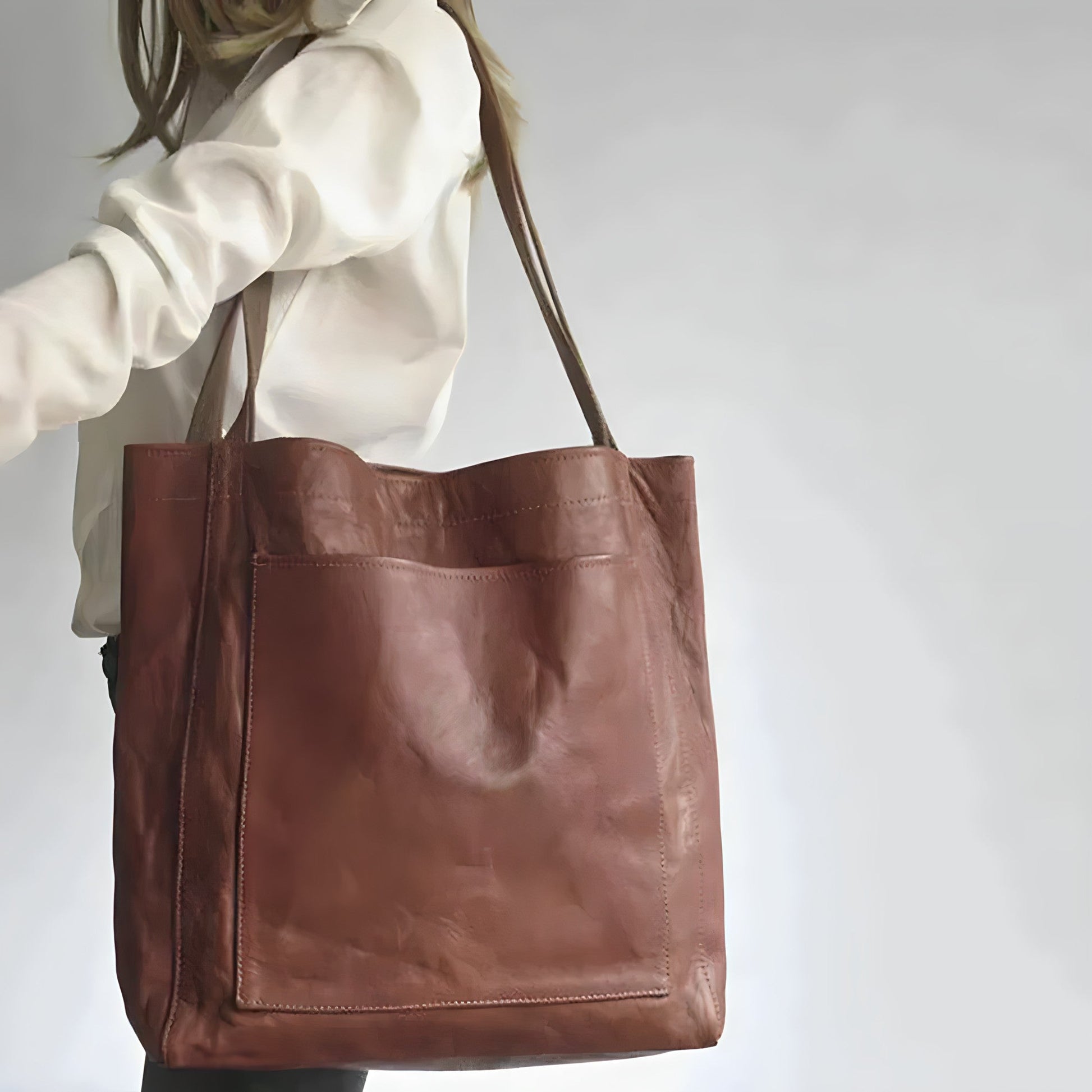 "Elegante leren damestas met ruime opbergruimte en veilige sluiting, ideaal voor moderne vrouwen, verkrijgbaar in diverse kle