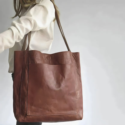 "Elegante leren damestas met ruime opbergruimte en veilige sluiting, ideaal voor moderne vrouwen, verkrijgbaar in diverse kle