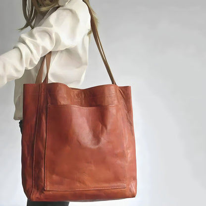 "Elegante leren damestas met ruime opbergruimte en veilige sluiting, ideaal voor moderne vrouwen, verkrijgbaar in diverse kle