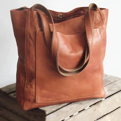 "Elegante leren damestas met ruime opbergruimte en veilige sluiting, ideaal voor moderne vrouwen, verkrijgbaar in diverse kle