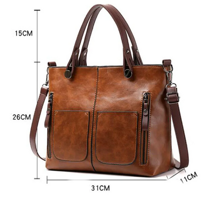 "Elegante leren schoudertas met magnetische sluiting, duurzaam bruin leer, verstelbare riem voor draagcomfort."