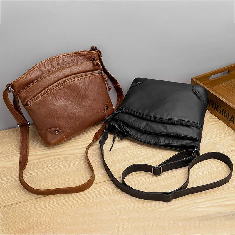"Elegante leren schoudertas voor dames, zwart of bruin, met klep en verstelbare riem, weerbestendig en stijlvol ontwerp."
