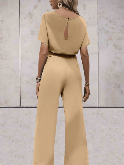"Elegante Noa jumpsuit voor dames met wijde mouwen en striklinten, comfortabele luchtige stof, ideaal voor elke gelegenheid."