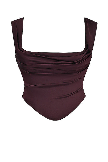 "Elegante satijnen Odette set met corset-top en maxirok, luxe diepe tinten voor stijlvolle vrouwelijke uitstraling."