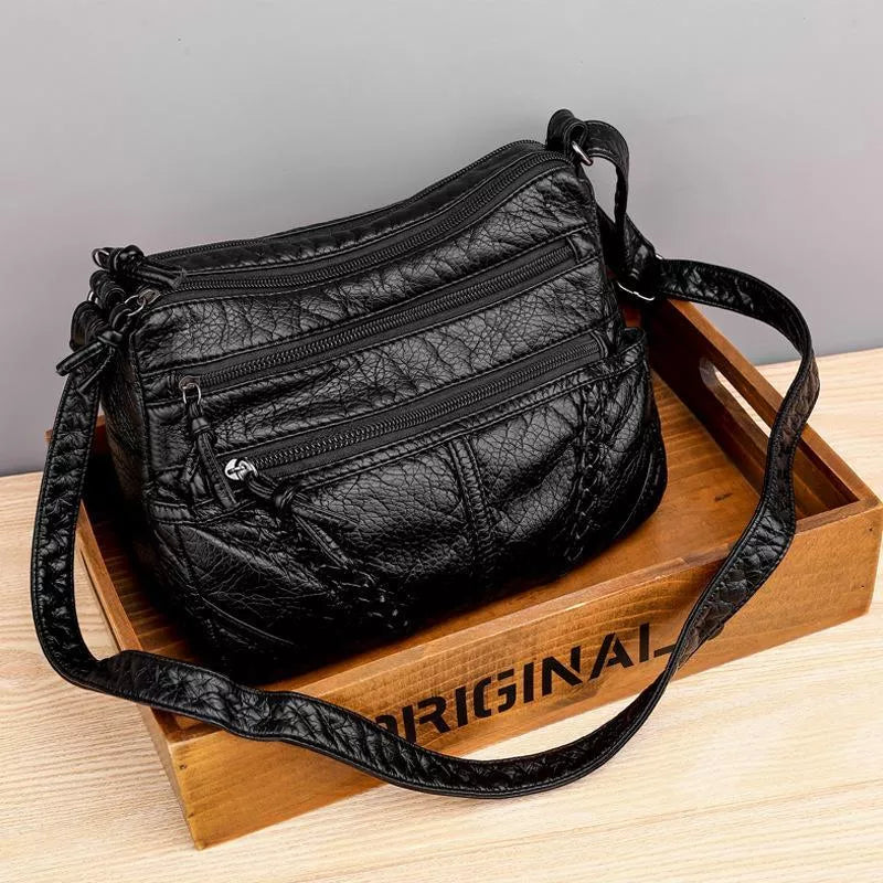 "Elegante schoudertas van hoogwaardig Zwitsers leer, tijdloze stijl, verstelbare riem, praktisch ontwerp, damesaccessoire."