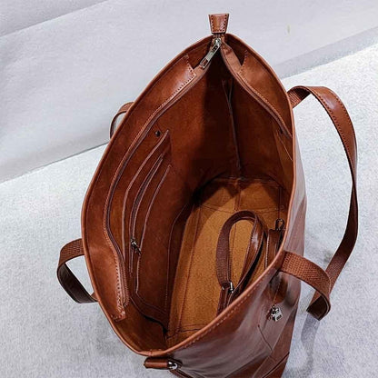 "Elegante vintage leren draagtas van PU-leer met verstelbare schouderriem, ruim interieur en meerdere vakken."