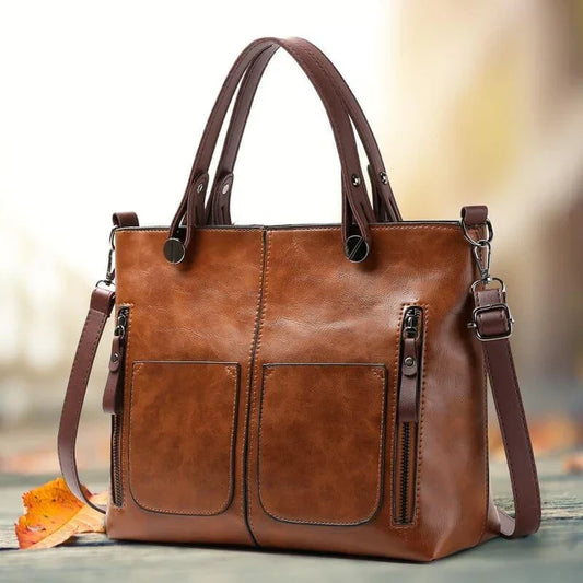 "Elegante vintage leren schoudertas voor dames met verfijnde stiksels en ruime opbergvakken, ideaal voor dagelijks gebruik."