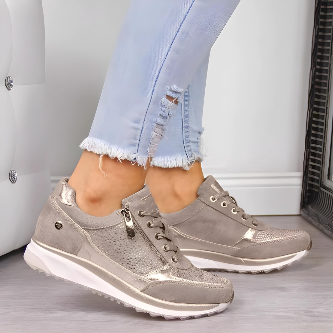 "Elegante vrouwen orthopedische sneakers, grijze tone, perfecte mix van comfort en stijl voor dagelijkse wandelingen."
