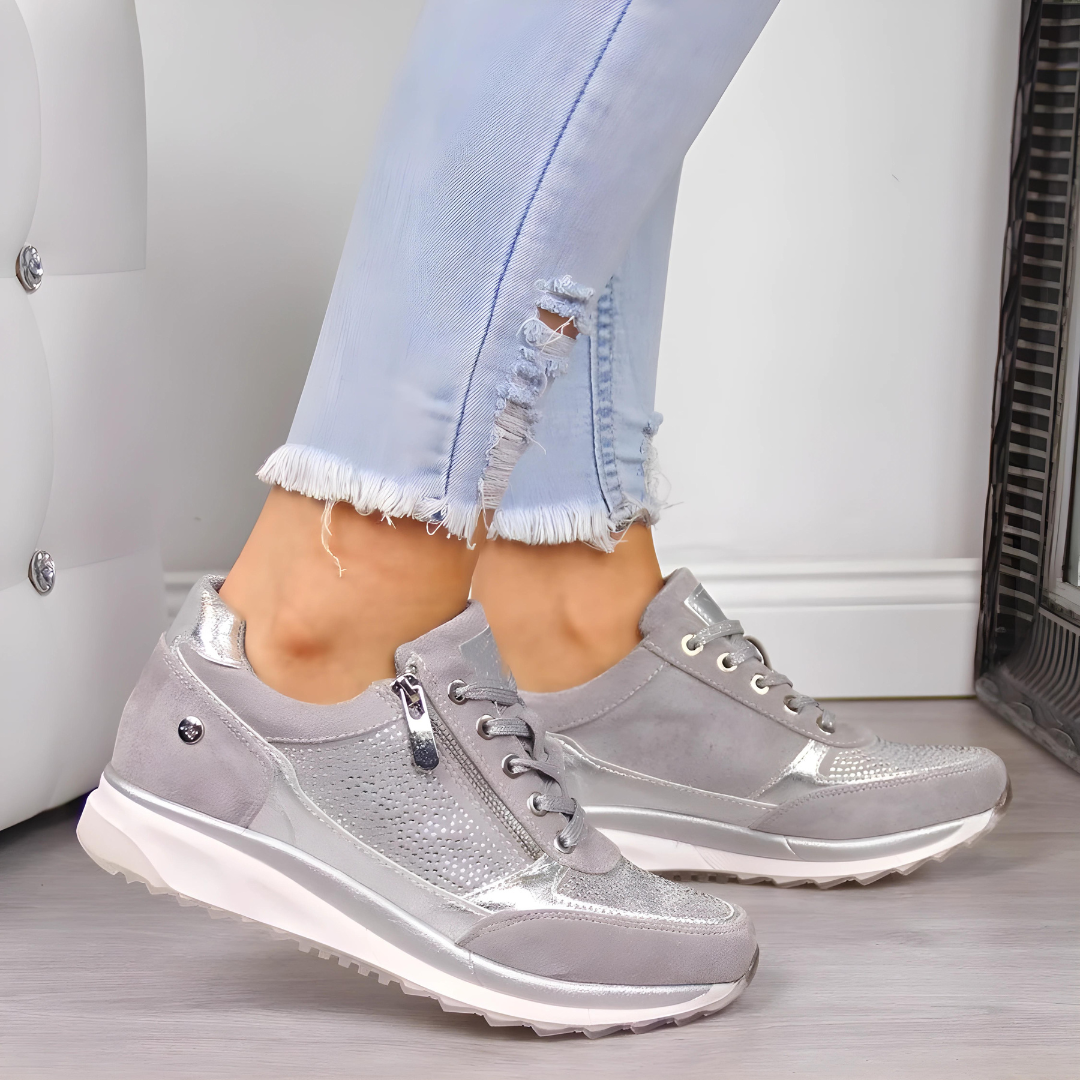 "Elegante vrouwen orthopedische sneakers, grijze tone, perfecte mix van comfort en stijl voor dagelijkse wandelingen."