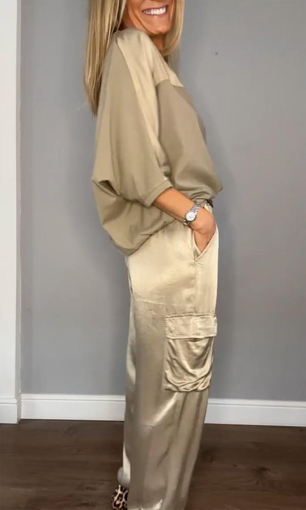 "Elegante zwarte dames set, inclusief blouse en rok, flatterende pasvorm met trendy design, perfect voor kantoor of uitje."