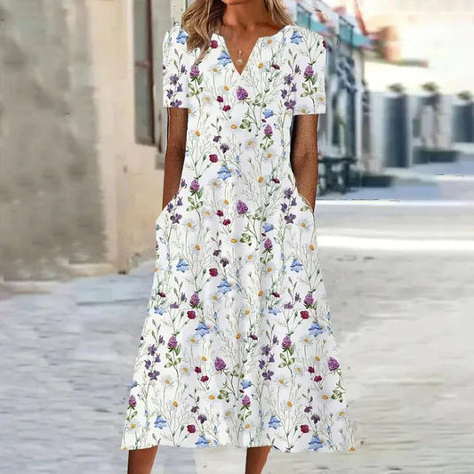 "Elisabeth casual zomerjurk met levendige bloemenprint, comfortabele pasvorm en functionele zakken voor dameskleding"