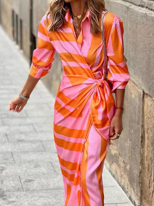 "Elouise wikkel zomerjurk met kraag, elegant en stijlvol design. Accentuert de taille, ideaal voor elke gelegenheid."