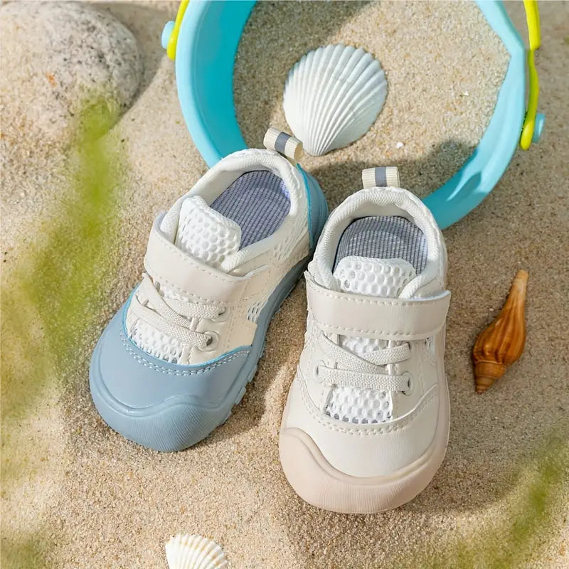 Flexibele Ember barefoot babyschoenen, zacht en ademend, met antislip zool. Perfect voor comfort en natuurlijke voetontwikkel