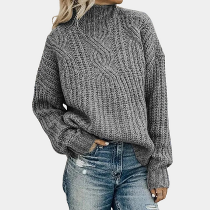 Grijze zacht gebreide damestrui, comfortabel en stijlvol design, perfect voor koude dagen, verkrijgbaar in diverse kleuren.
