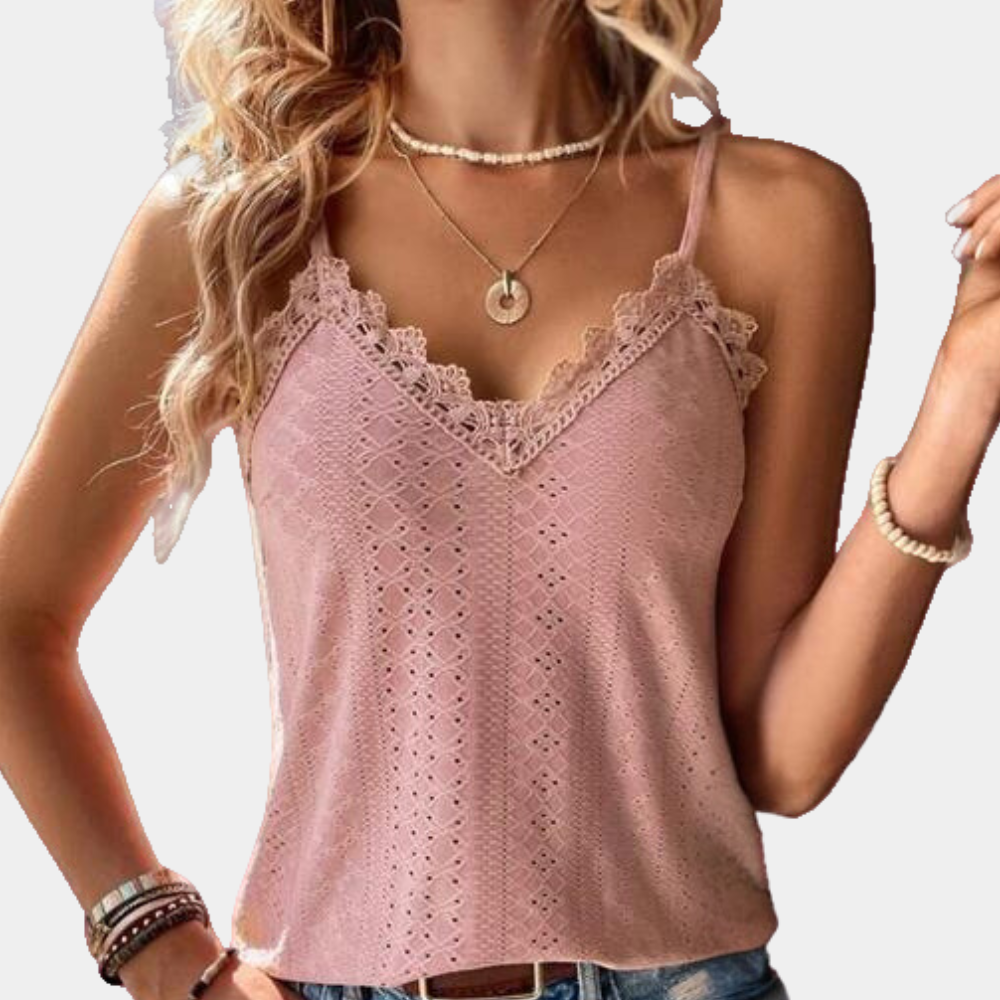 "Groene zomerse damestop met V-hals en eyelet borduursel, luchtig en stijlvol voor een elegante look."
