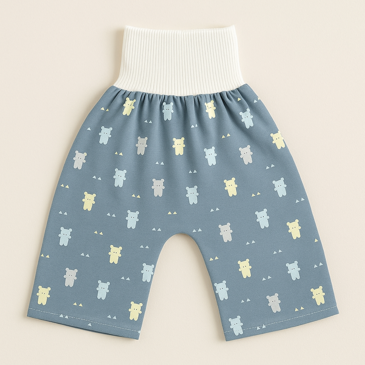 "Herbruikbare baby training pants, comfortabel en milieuvriendelijk, met schattige blauwe beertjes en roze hondjes patroon."