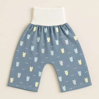 "Herbruikbare baby training pants, comfortabel en milieuvriendelijk, met schattige blauwe beertjes en roze hondjes patroon."