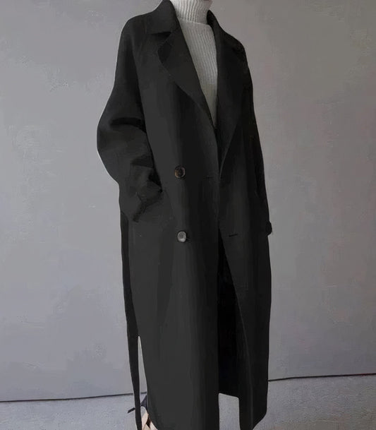 "Lange elegante wollen damesjas in het grijs, warmtehoudend en tijdloos, perfect voor stijlvolle winterlooks."