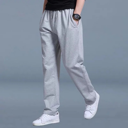 "Lichte heren joggingbroek, katoen, comfortabele pasvorm, elastische taille, moderne wijde pijpen, minimalistische stijl."