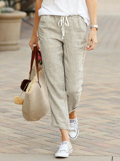 "Lichtgewicht linnen broek voor dames, luchtige pasvorm, licht van tint, perfect voor warme dagen en zomerse outfits."
