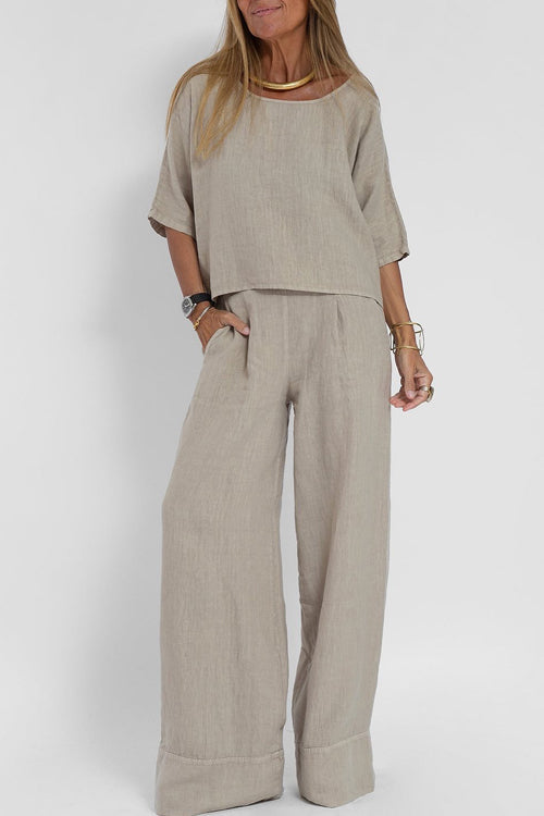 Luchtig katoen-linnen pak voor dames met een cropped shirt en wijde broek, perfect voor een stijlvolle zomerse look.