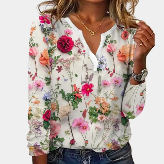 "Luchtige casual damesblouse met kleurrijk bloemmotief, perfect voor zomer; combineerbaar met jeans of rokken."