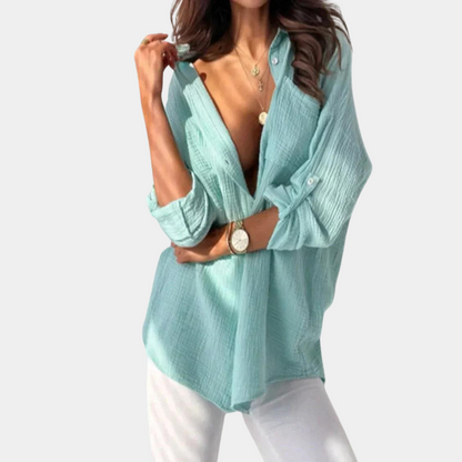 "Luchtige dames zomerblouse, kleurrijk in oranje, roze, grijs en blauwgroen, perfect voor casual en semi-formele looks."