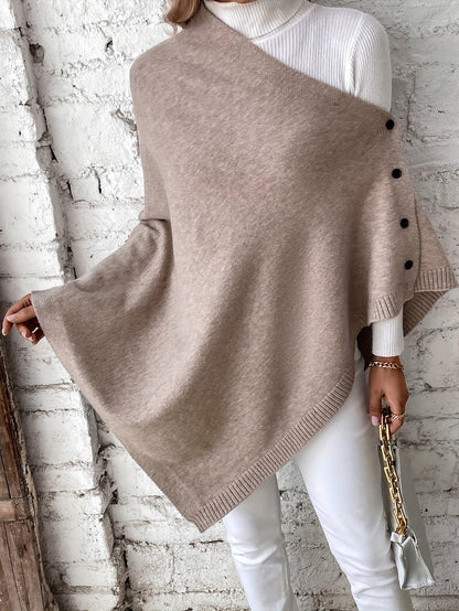 Luxe dames poncho met knoopsluiting, zachte stof, stijlvolle afwerking. Perfect voor casual en formele gelegenheden.