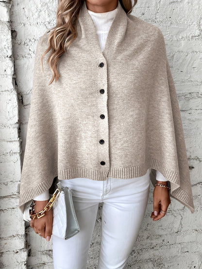 Luxe dames poncho met knoopsluiting, zachte stof, stijlvolle afwerking. Perfect voor casual en formele gelegenheden.