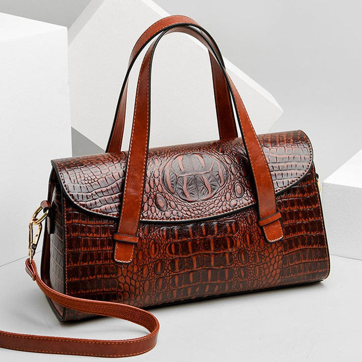 Luxe lederen damestas, bruin, elegant design met stevige handgrepen en verstelbare riem, voor dagelijks en zakelijk gebruik.