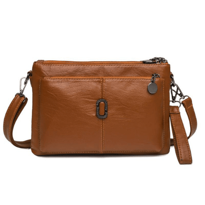 Luxe leren schoudertas voor dames, elegant design met ruime compartimenten en hoogwaardige afwerking, in diverse kleuren.