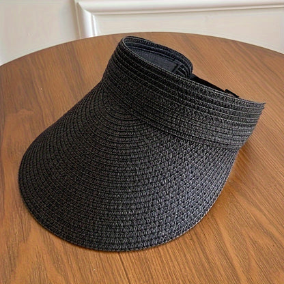 "Opvouwbare zonneklep met brede rand, beige, zwart of navy, biedt stijl en zonbescherming voor zonnige dagen."