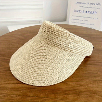 "Opvouwbare zonneklep met brede rand, beige, zwart of navy, biedt stijl en zonbescherming voor zonnige dagen."