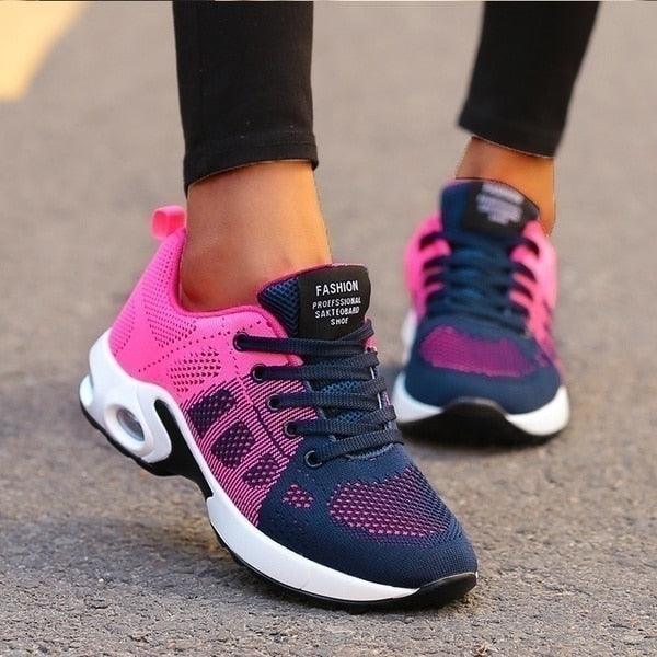 "Orthopedische dames sneakers, wit en blauw, ergonomische pasvorm voor comfort en ondersteuning bij actieve levensstijl."