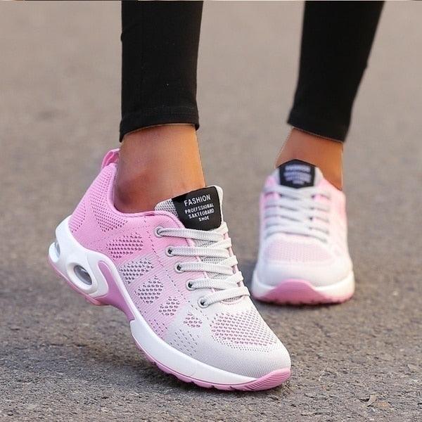 "Orthopedische dames sneakers, wit en blauw, ergonomische pasvorm voor comfort en ondersteuning bij actieve levensstijl."